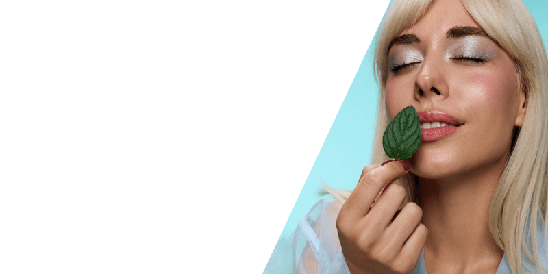 Woman holding a mint leaf